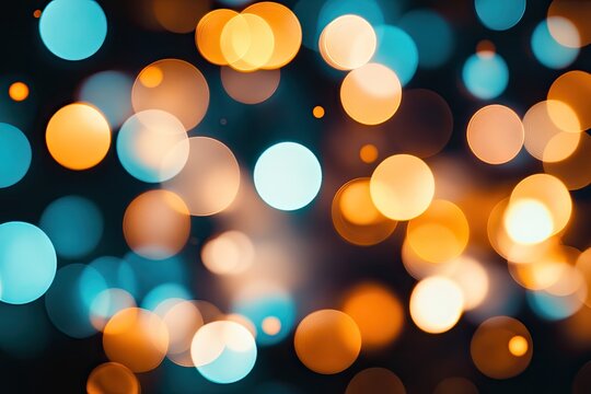Blurred teal & gold bokeh lights on dark background