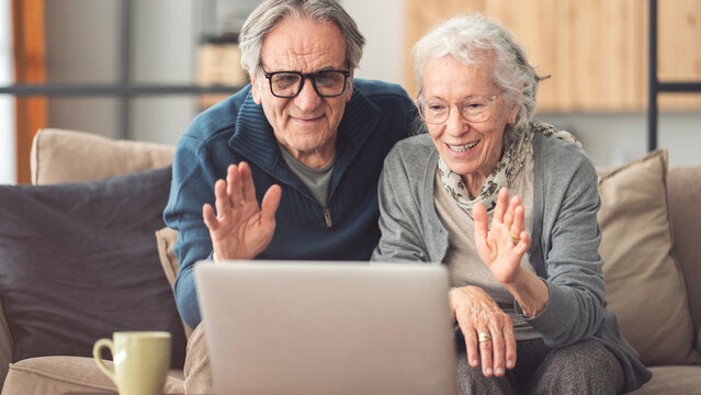 Elderly couple using computer for video call