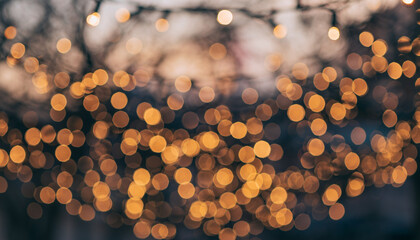 Warm golden bokeh lights creating a soft and festive background ambiance.