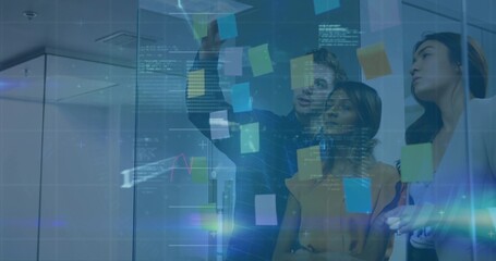 Reaching man in dark shirt placing sticky note on glass wall at office, with digital overlays