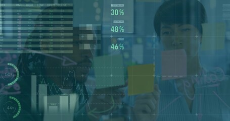Placing sticky notes, team organizing data on glass in office wearing business casual HUD overlays