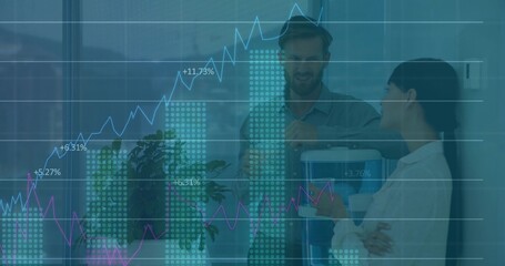 Standing coworkers in business wear holding cup, gesturing by water cooler with financial charts