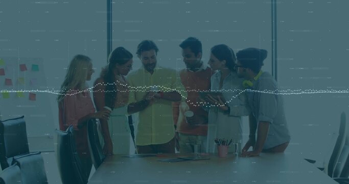 Leaning six colleagues in business attire studying smartphone at conference table, sticky notes