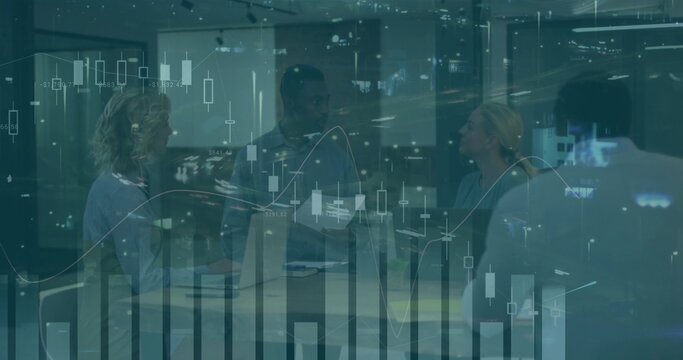 Analyzing team of four in bizcasual reviewing data at conference table, laptops and market charts - Powered by Adobe