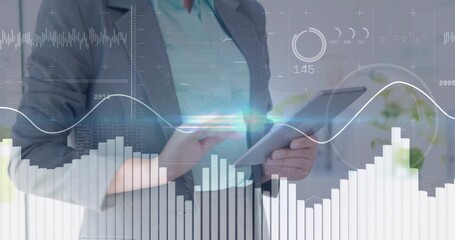 Holding woman executive in grey blazer teal blouse tapping tablet at desk, with data overlays © vectorfusionart