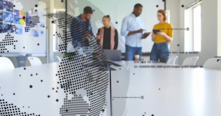Discussing four staff wearing business-casual in conference room with tablet notebook at long table