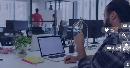 Working bearded man plaid shirt holding phone typing laptop at office with social icons, copy space
