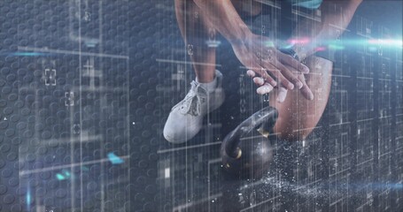 Preparing man bracing, gripping kettlebell at gym on mat, shorts, white shoes, chalk, light streaks