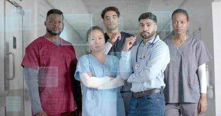 Posing five care staff wearing scrubs and dress shirt showing stethoscope in hospital unit with HUD