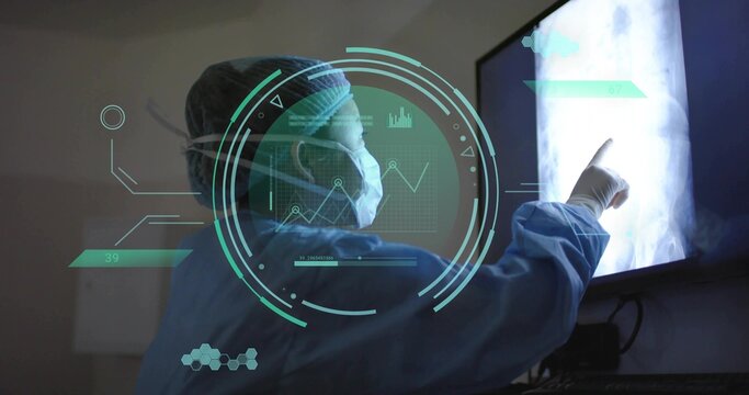 Pointing female doctor in scrubs and mask examining X-ray display in radiology room, teal AR HUD