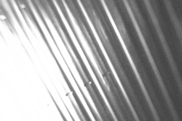 Abstract diagonal grayscale stripe background with transparent PNG fade, dynamic angled lines for modern tech overlays, motion effect design or digital textures