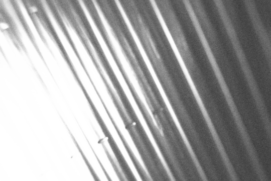 Abstract diagonal grayscale stripe background with transparent PNG fade, dynamic angled lines for modern tech overlays, motion effect design or digital textures