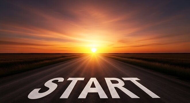 Start line on a long road leading to a bright sunset horizon