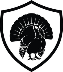 Black silhouette of a turkey displayed within a shield emblem