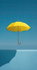 Yellow umbrella floating above a blue surface, bright sky