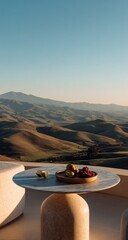Fruit on table with rolling hills background, clear sky