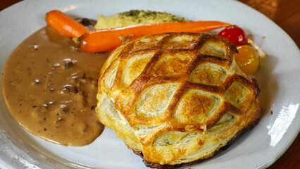 Beef Wellington in puff pastry.
