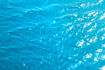 Turquoise rippled water texture background. 