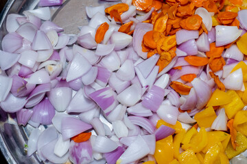 Freshly chopped vegetables ready for cooking, a colorful culinary preparation