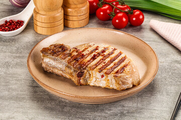 Grilled pork loin steak with bone