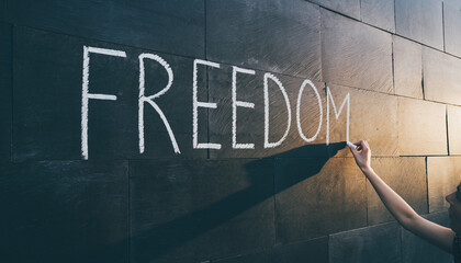 Writing Freedom on a Wall with Chalk