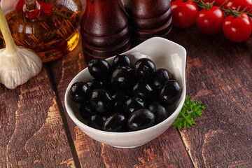 Mediterranean marinated Black olives in the bowl