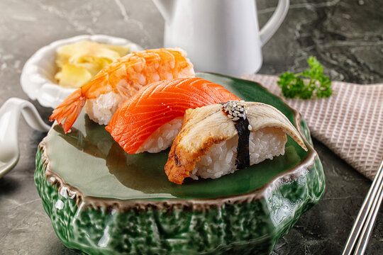 Japanese cuisine - sushi with eel, salmon and prawn - Powered by Adobe