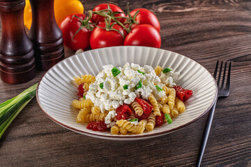 Italian pasta fusili with curd