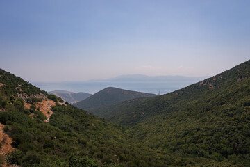 view of the mountains on a sunny day. Sea in the background.