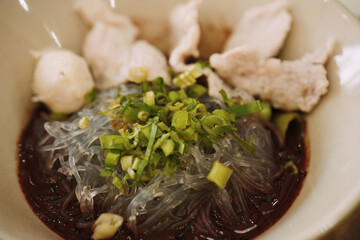 The Dark Broth: Close-up on Traditional Thai Boat Noodle Soup