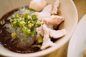 The Dark Broth: Close-up on Traditional Thai Boat Noodle Soup