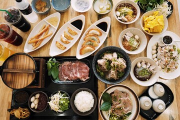 Overhead View of a Full Thai Noodle and Side Dish Spread
