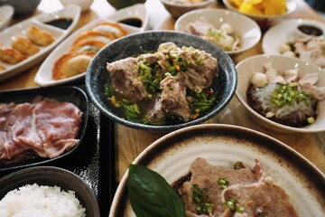 Overhead View of a Full Thai Noodle and Side Dish Spread