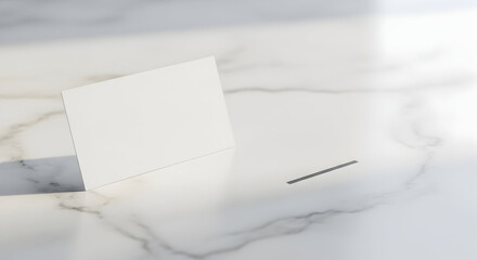 Clean white card stands on elegant marble surface with soft shadow and light creating professional minimalist scene