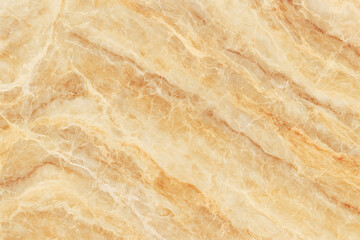 Natural beige marble texture background with wavy veins. Luxury cream onyx stone surface pattern. Polished yellow granite wall or floor tile for interior design architecture.