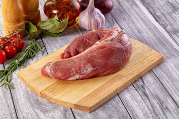 Raw pork sirloing over board