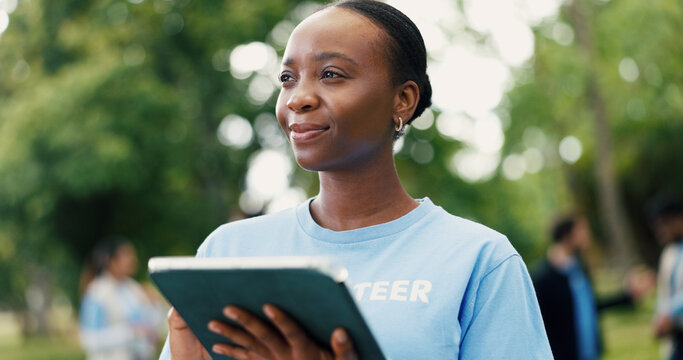 Woman, volunteer and thinking with tablet in nature for eco friendly development or campaign. Female person, activist or thoughtful NGO with technology for environmental growth or change in park