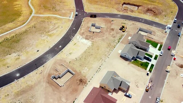 Fly over New Houses and Empty Lots in New Subdivision Construction