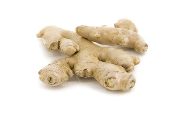 Fresh ginger depicted on bright white backdrop.