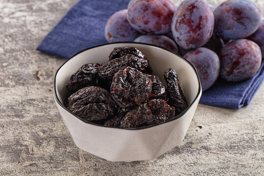 Black dry sweet prunes heap