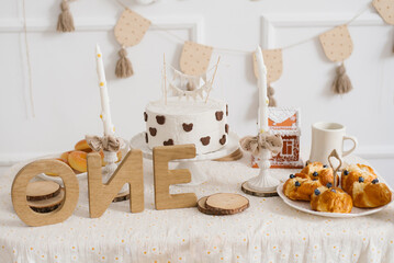 First Birthday Cake Table With Rustic Decor And Sweets