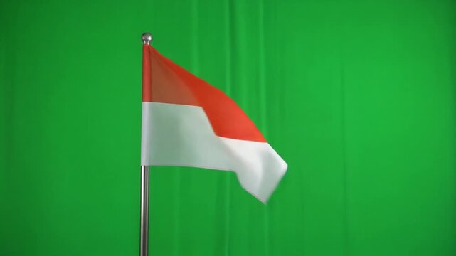 The Indonesian flag is flying on green screen isolated with chroma key. 