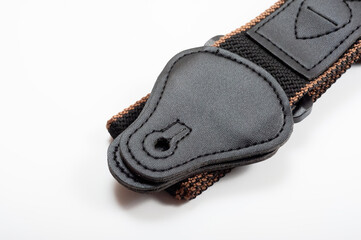 Black fabric strap for electric or acoustic guitar.