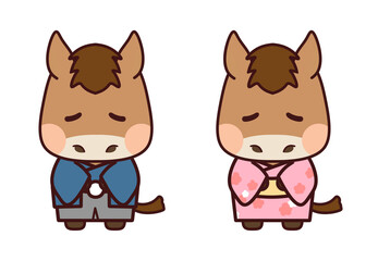 青とピンクの着物を着てお辞儀する栗毛の馬