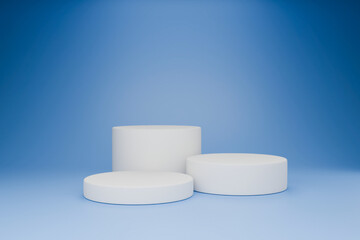 The white cylindrical objects are resting on the blue background