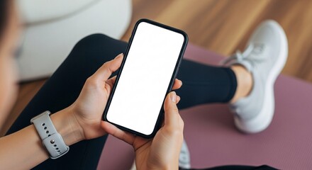 Modern Mockup Mobile Phone for Fitness Apps and Online Yoga Classes A Woman Using Smartphone With Blank White Screen During Workout at Home Health and Technology