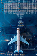 Toy plane on electronic computer circuit board hardware technology. Motherboard digital chip. Computer components. Top view. Copy space.