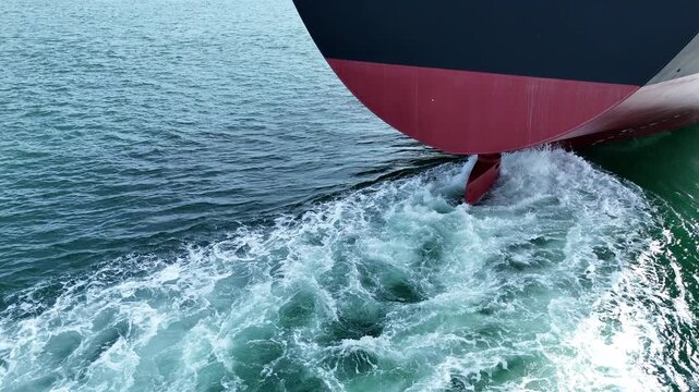 Propeller of large ship underwater spinning power working and water splash contrail . Close up image detail of Propeller ship, Logistics Transportation industry express technology of ship. Freight