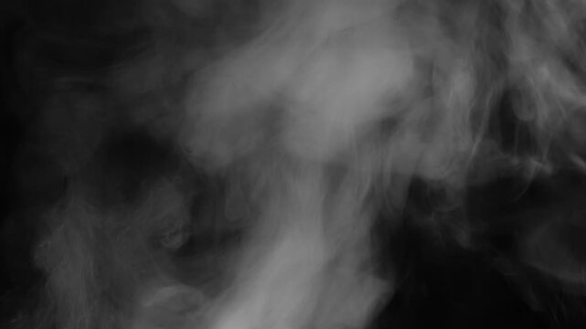 Billowing white steam looking like smoke on black background in slow motion, abstract atmospheric footage for magic, fantasy, pollution or mystery projects, no people