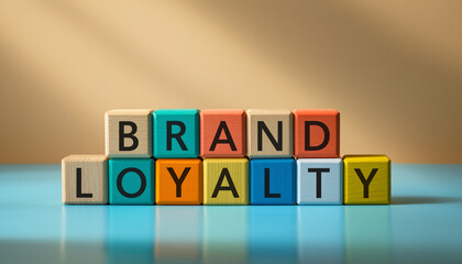 Colorful Wooden Blocks Spelling Brand Loyalty on a Blue Surface.